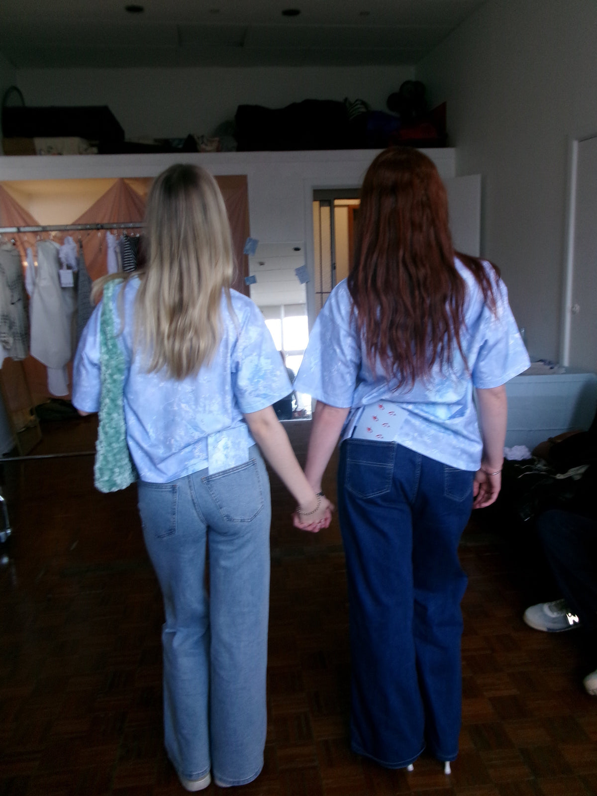 [two_girls_holding_hands_wearing_sky_blue_sustainably_made_tshirts]-[love_zainab]